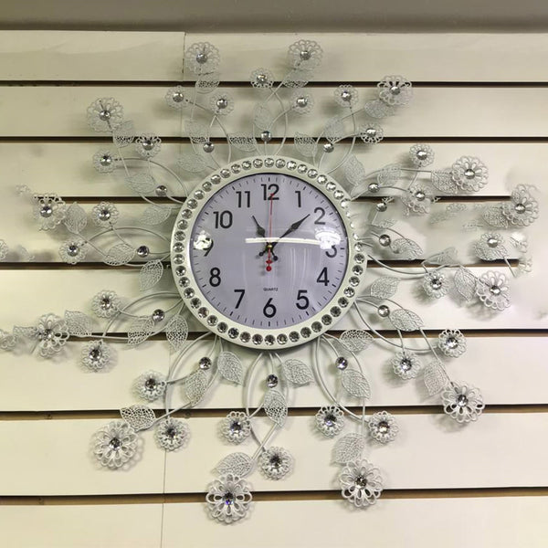 The clock hands are a sleek silver, and the numbers are displayed in a clear, easy-to-read font. This timepiece exudes sophistication and would make a beautiful addition to any home or office."
