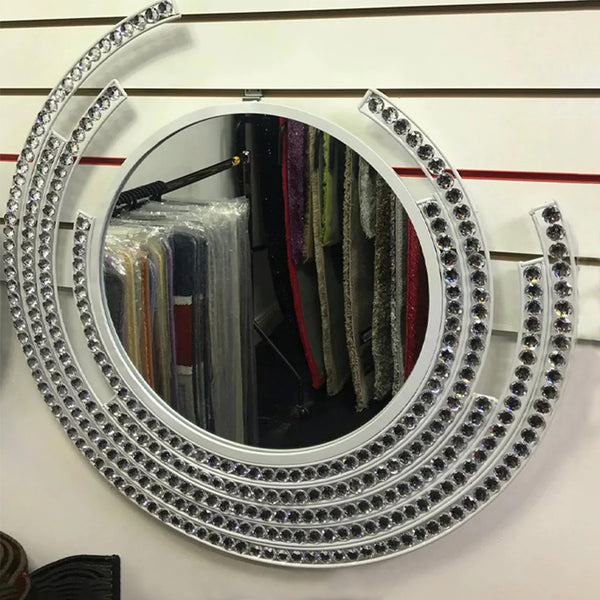 White round wall mirror with diamond accents and a sparkling frame