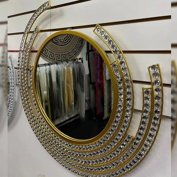 Gold round wall mirror with diamond accents and a sparkling frame