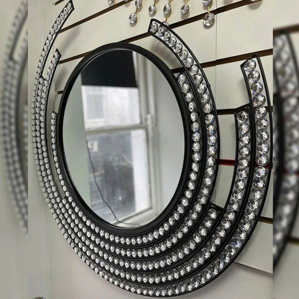 Black round wall mirror with diamond accents and a sparkling frame